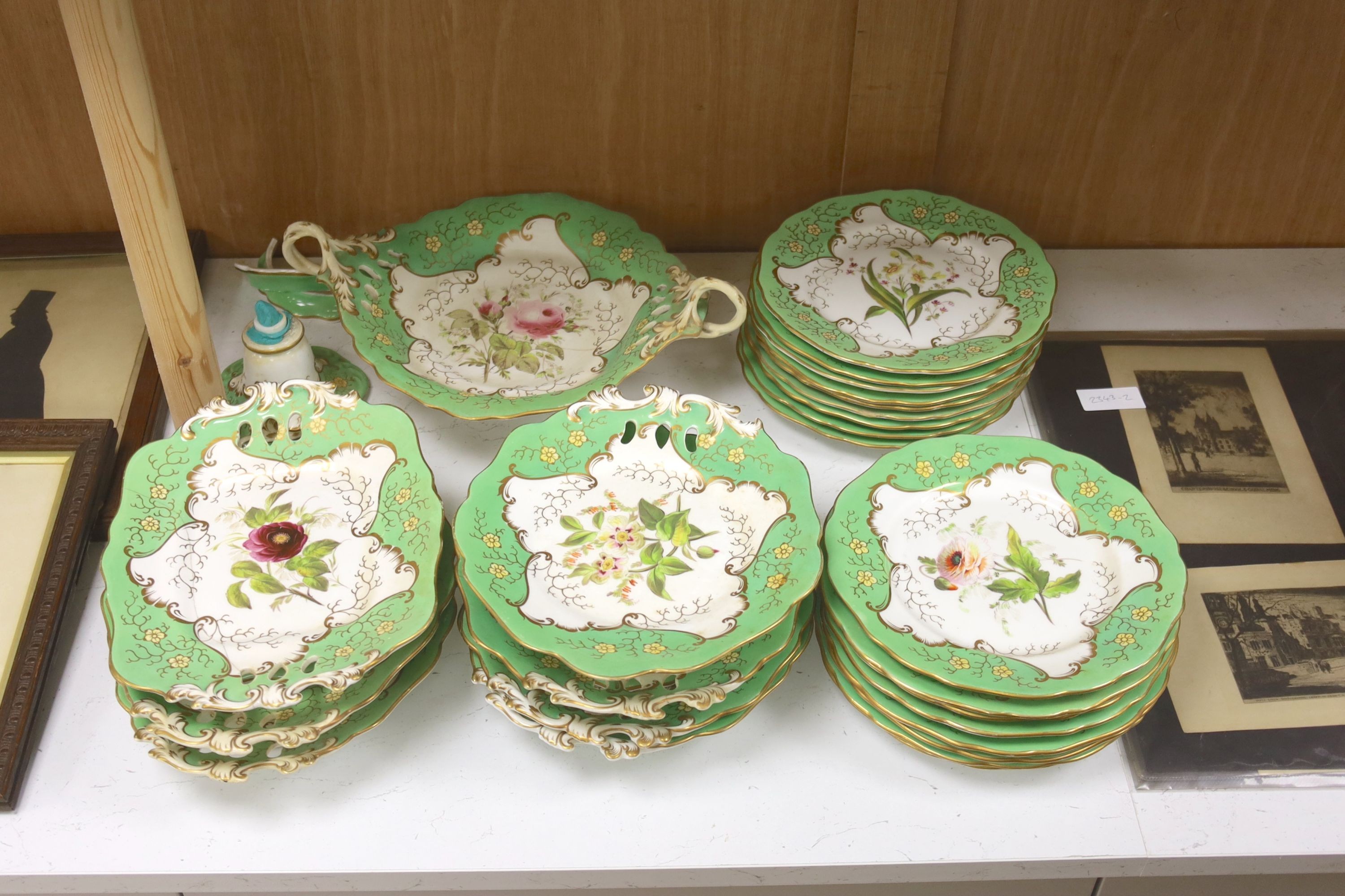 A mid 19th century Staffordshire porcelain 24 piece green bordered part dessert service, painted with floral prays